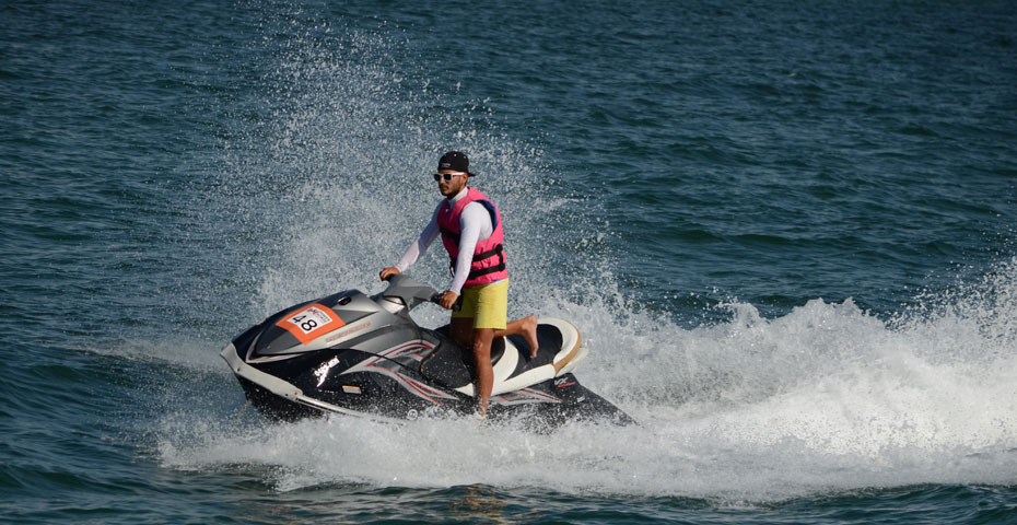 Jet skis racing across turquoise water